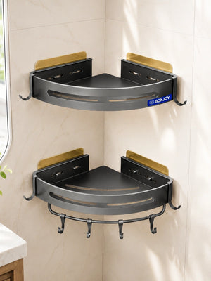 Grey BOXJOY wall-mounted corner shelfs installed on a tiled bathroom wall.