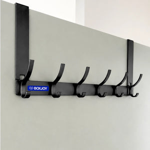 Grey BOXJOY over-the-door metal hanger with six rounded hooks mounted on a white door.