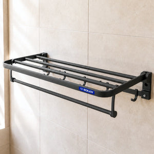 Black BOXJOY wall-mounted bathroom shelfs with a lower towel bar and hooks installed on a tiled wall