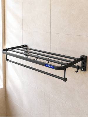 Black BOXJOY wall-mounted bathroom shelfs with a lower towel bar and hooks installed on a tiled wall