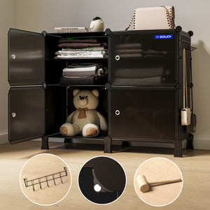 Black storage cabinet with open doors showing organized shelves, a teddy bear, and a chair in a room setting.