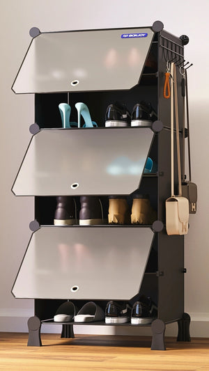 Black BOXJOY modular shoe wardrobe with 6 shelfs, smoky transparent doors, and side hooks, neatly storing various pairs of shoes.