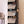 Black BOXJOY modular shoe wardrobe with 8 shelfs, transparent doors, and side bag hooks.