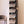 Tall black BOXJOY modular shoe wardrobe with 10 shelfs, transparent doors, and side bag hooks.