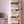 White BOXJOY modular shoe wardrobe with 8 shelfs, transparent doors, and side bag hooks.
