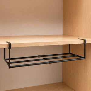Black BOXJOY expandable hanging shelfs mounted under a wooden cabinet board.