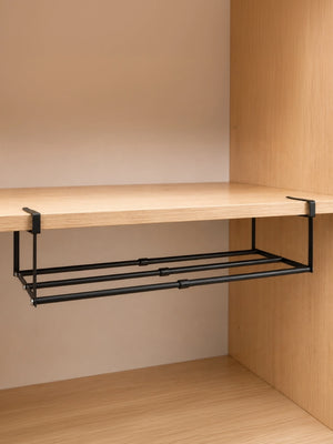 Black BOXJOY expandable hanging shelfs mounted under a wooden cabinet board.