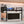 Black BOXJOY microwave shelfs holding kitchen accessories and hanging mugs above a microwave.