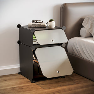 BOXJOY 2-tier black modular bedside nightstand with translucent flip doors placed next to a bed.