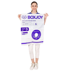 Woman holding a BOXJOY Pack of 3 Large vacuum storage bag with free hand pump.