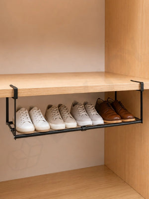 Black BOXJOY under-cabinet hanging shelfs holding four pairs of shoes.