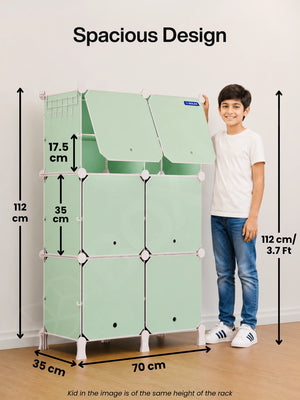 Spacious design of the BOXJOY Plastic 12 Shelf Green Kids Wardrobe next to a 112 cm tall boy.