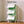 Spacious dimensions of the 6 green and white modular shelfs, showing a 97 cm height, 40 cm width, and 30 cm depth.