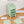Durable material of the green wardrobe with 6 shelfs showing a sturdy metal frame and plastic doors.