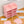 Durable material of the pink wardrobe with 12 shelfs showing a sturdy metal frame and plastic doors.