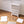 Easy to assemble white modular wardrobe with 8 shelfs shown partially built next to a mallet.