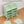 Easy to assemble BOXJOY Plastic 12 Shelf Green Kids Wardrobe shown partially built without tools.