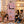 Smiling family watching children play next to the BOXJOY Plastic 6 Shelf Pink Kids Wardrobe.
