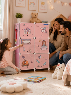 Family watching a girl point at princess stickers on the BOXJOY Plastic 12 Shelf Pink Kids Wardrobe.