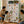Smiling family watching a boy point at jungle stickers decorating his green wardrobe with 7 shelfs.