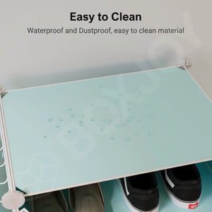 Top-down close-up of water droplets on a light blue panel of the BOXJOY 6 shelf modular wardrobe, highlighting the waterproof material.
