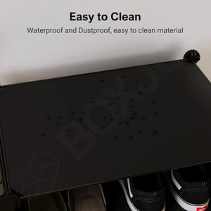 Water droplets on the black BOXJOY 6 tier shelfs, demonstrating the waterproof and easy-to-clean material of the wardrobe.