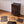Easy to assemble black BOXJOY modular shoe wardrobe with 8 shelfs, shown partially built alongside unboxed panels and a wooden mallet.