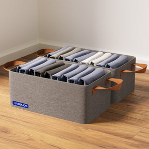 Set of 2 BOXJOY dark grey fabric wardrobe storage baskets filled with folded shirts on a wooden floor.